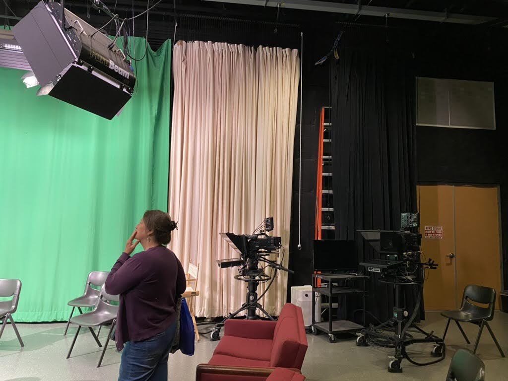 Lori Clinchard helping set up for oral history recordings in the Media Learning Center. May 2024