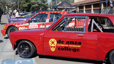 red muscle car with De Anza Auto Tech logo on door